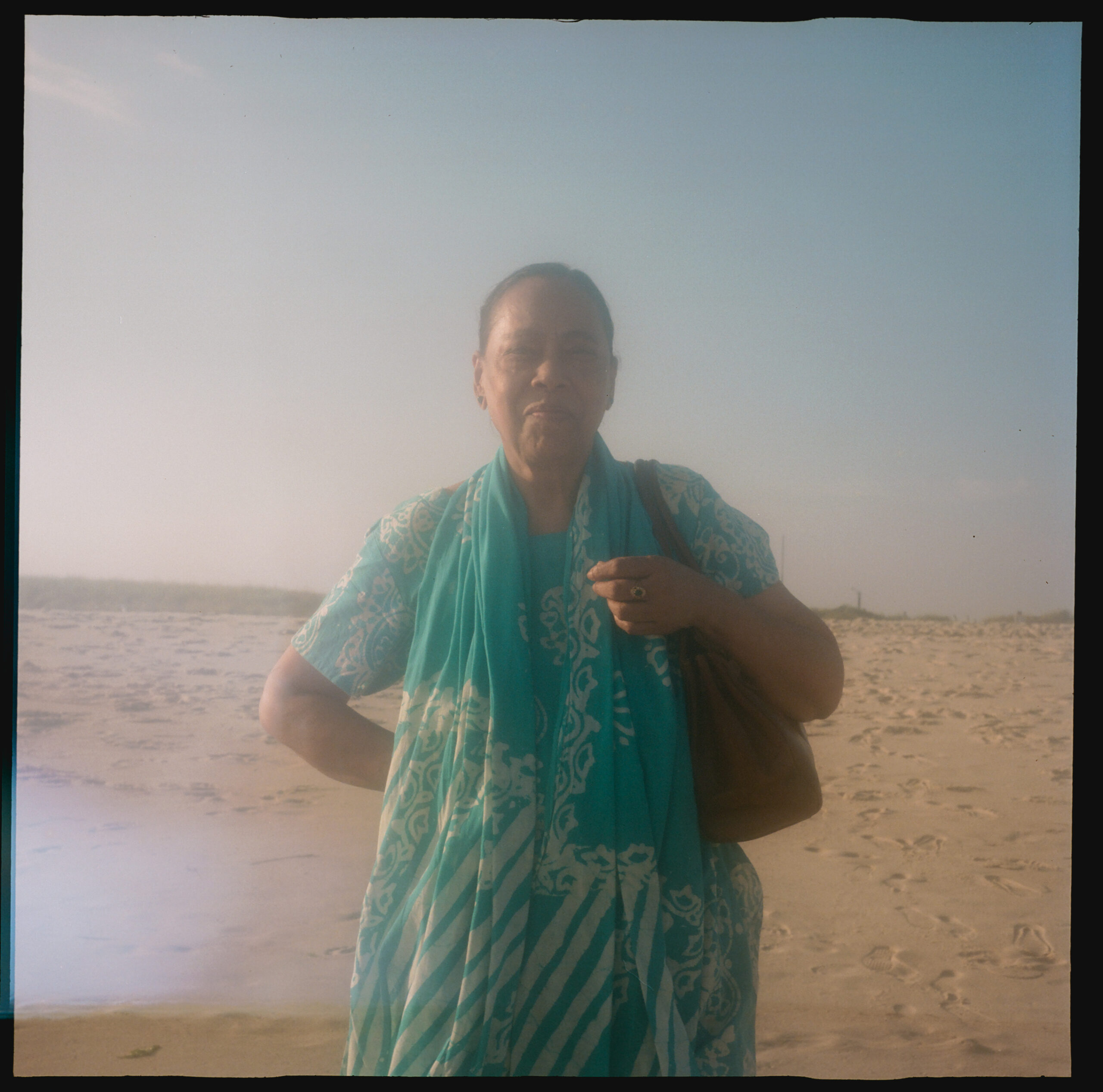 My mother smiling on the beach